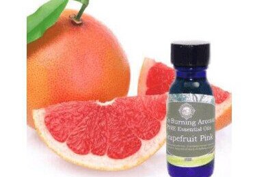 grapefruit essential oil with a grapefruit
